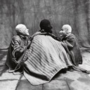 Cuzco: Three Sitting Men in Masks (Neg. 611), Cuzco, 1948, Irving Penn, American